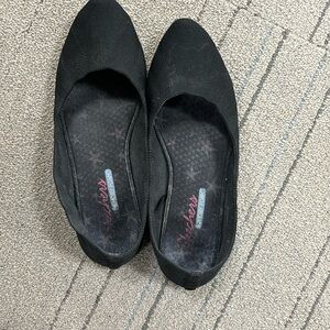 Worn out sketchers memory foam flats
